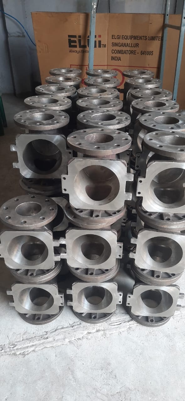 Stacked cast iron valve or pump bodies with machined flange faces and bores